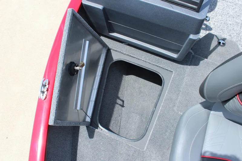 Slide: The Image of 2026 Tracker Super Guide V-16 SC boat interior with seat and orange paddle. - 16