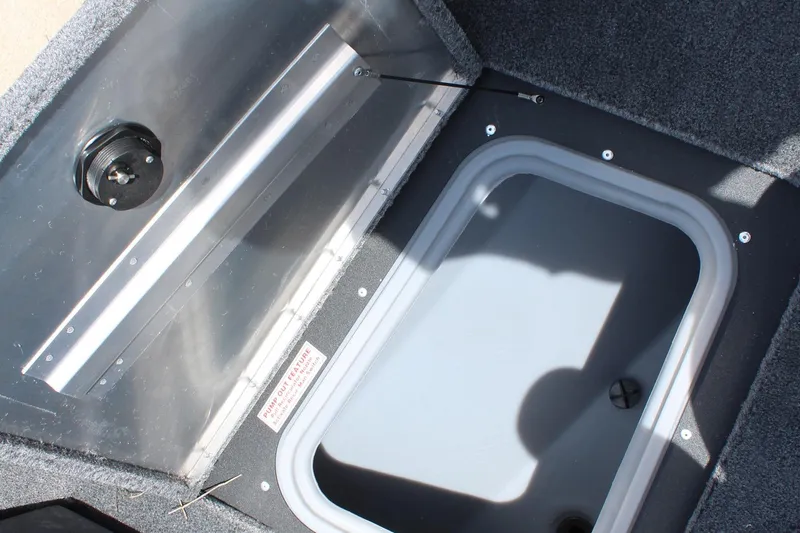 Slide: The Image of 2026 Tracker Super Guide V-16 SC boat interior with steering wheel and seating. - 17