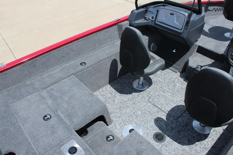 Slide: The Image of 2026 Tracker Super Guide V-16 SC boat with 40 HP motor, parked outdoors. - 6