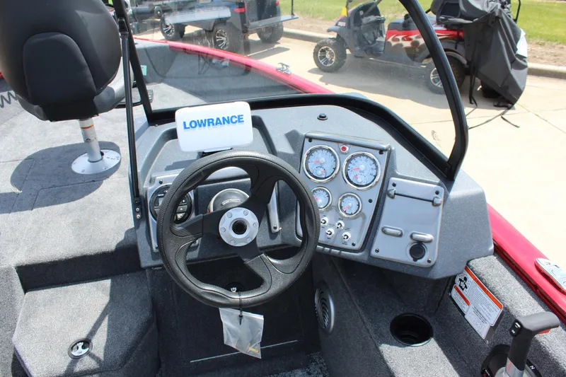 Slide: The Image of 2026 Tracker Super Guide V-16 SC boat dashboard with steering wheel and Garmin device. - 9
