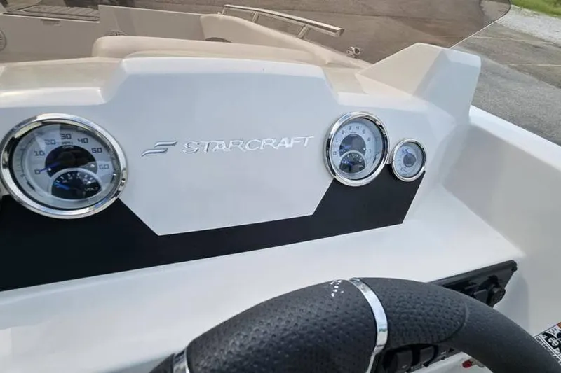 Slide: The Image of 2023 Starcraft SVX 171 OB dashboard with gauges and steering wheel. - 3