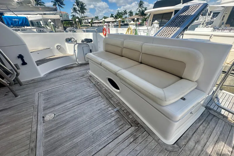 Slide: The Image of Luxury yacht Azimut 58, 1999 model, featuring a spacious deck with comfortable seating. - 24