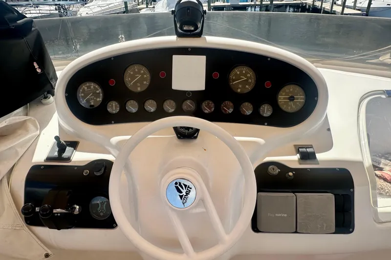Slide: The Image of Cockpit of a 1999 Azimut 58 yacht with steering wheel and instrument panel. - 36