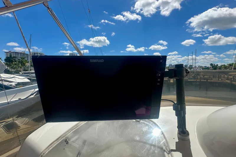 Slide: The Image of Simrad display on 1999 Azimut 58 yacht, sunny marina background. - 39