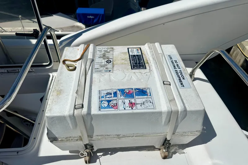 Slide: The Image of Life-saving equipment box on 1999 Azimut 58 yacht deck, secured with straps. - 47