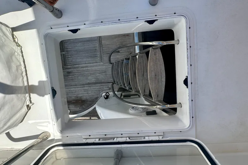 Slide: The Image of Hatch view on 1999 Azimut 58 yacht, showcasing interior ladder and deck details. - 48