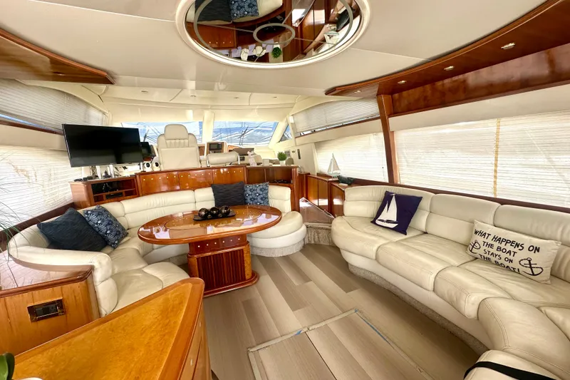 Slide: The Image of Luxurious interior of a 1999 Azimut 58 yacht with elegant seating and decor. - 50
