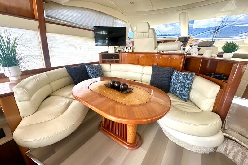 Slide: The Image of Luxurious interior of a 1999 Azimut 58 yacht with plush seating and elegant decor. - 52