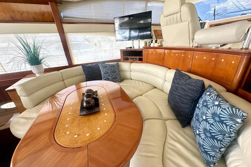 Slide: The Image of Luxurious interior of a 1999 Azimut 58 yacht with elegant seating and decor. - 53