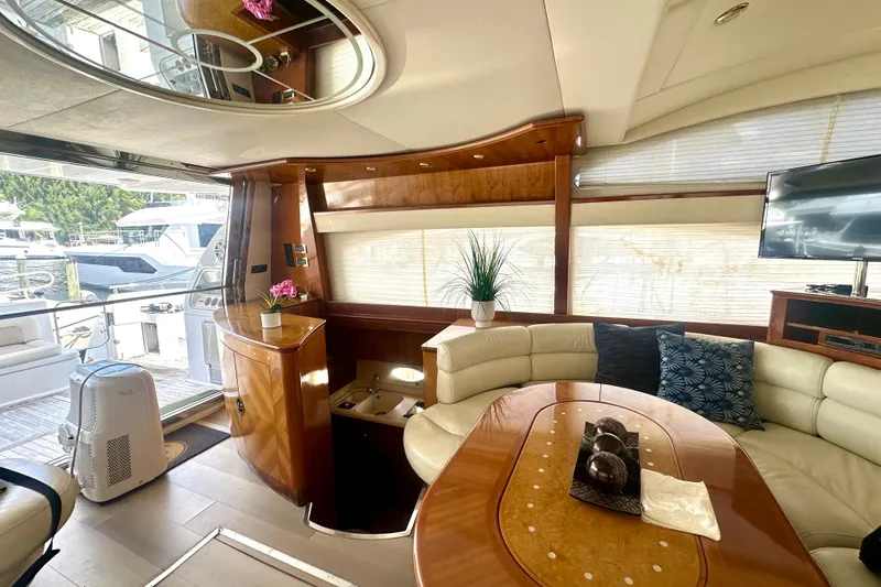 Slide: The Image of Luxurious interior of a 1999 Azimut 58 yacht with elegant seating and decor. - 62