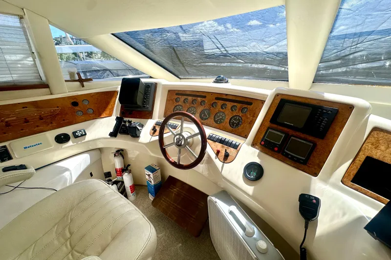 Slide: The Image of Cockpit of 1999 Azimut 58 yacht with navigation instruments and steering wheel. - 69