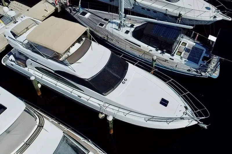 Slide: The Image of Aerial view of a 1999 Azimut 58 yacht docked at a marina. - 7