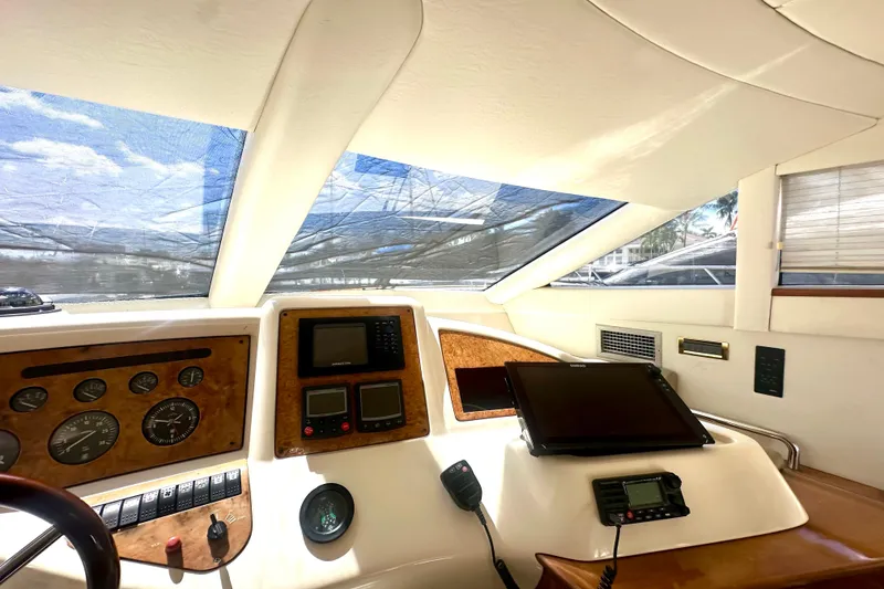 Slide: The Image of Interior view of a 1999 Azimut 58 yacht cockpit with navigation instruments. - 71