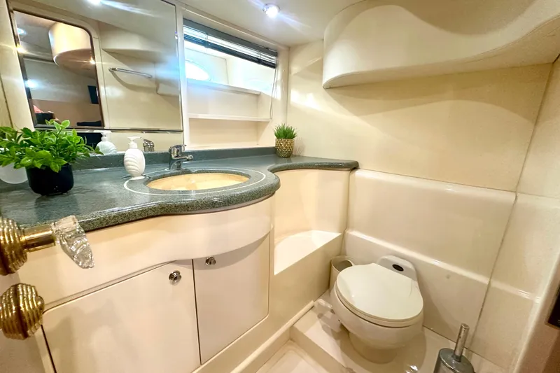 Slide: The Image of Luxurious bathroom in 1999 Azimut 58 yacht with modern fixtures and elegant design. - 81