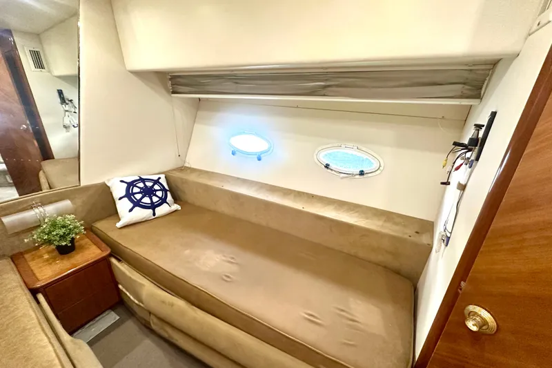 Slide: The Image of Interior of 1999 Azimut 58 yacht with cozy seating and nautical decor. - 85