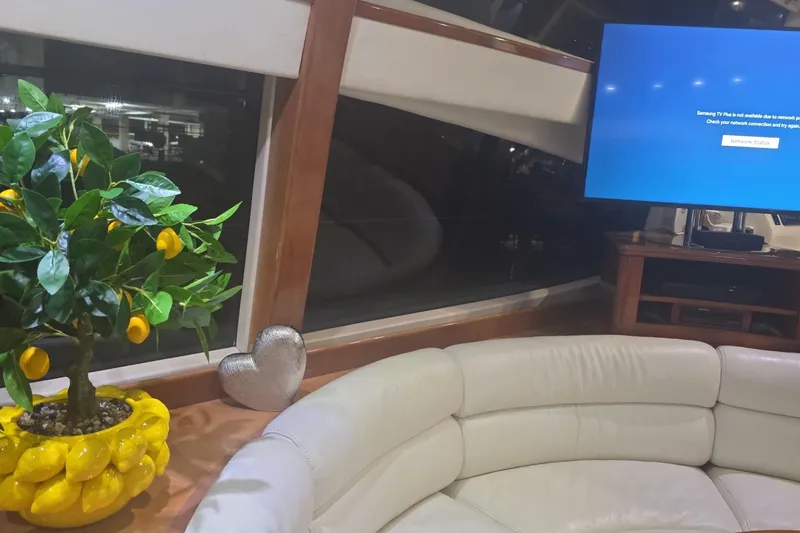 Slide: The Image of Interior of 1999 Azimut 58 yacht with lemon tree, heart decor, and TV. - 88