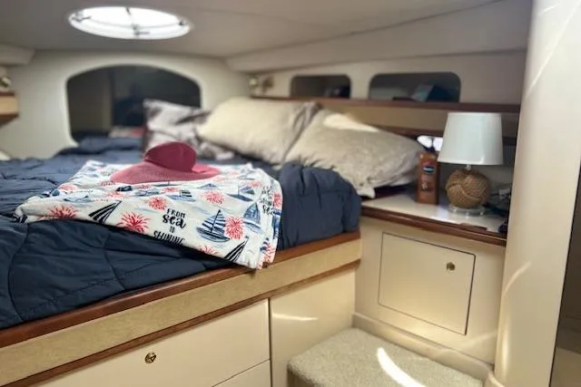 Slide: The Image of Cozy cabin interior of 2000 Cruisers 3575 yacht with bed and nautical decor. - 15
