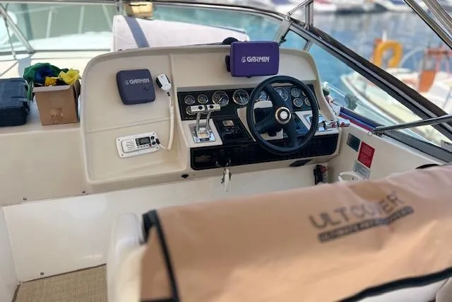 Slide: The Image of Cockpit of 2000 Cruisers 3575 boat with Garmin navigation system and steering wheel. - 6