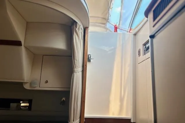 Slide: The Image of Interior view of a 2000 Cruisers 3575 yacht, featuring cabin and storage areas. - 10