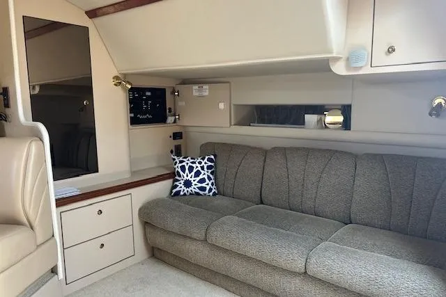 Slide: The Image of Interior of 2000 Cruisers 3575 yacht with gray sofa and decorative pillow. - 19