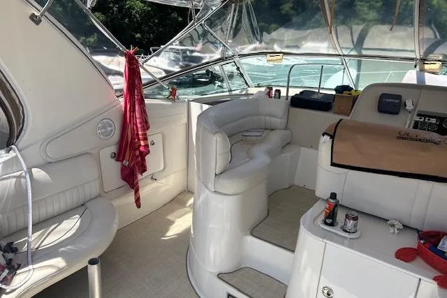 Slide: The Image of Interior of 2000 Cruisers 3575 yacht with seating and control panel. - 2