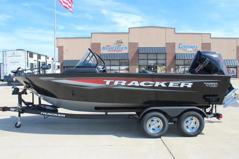 The Image of 2026 Tracker Targa V-18 Combo boat on trailer, parked outside dealership. - 0