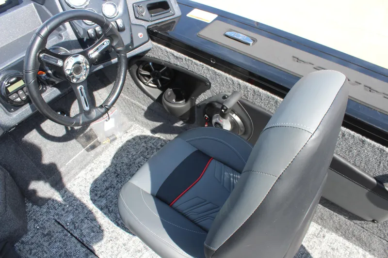 Slide: The Image of 2026 Tracker Targa V-18 Combo boat interior with steering wheel and seat. - 10