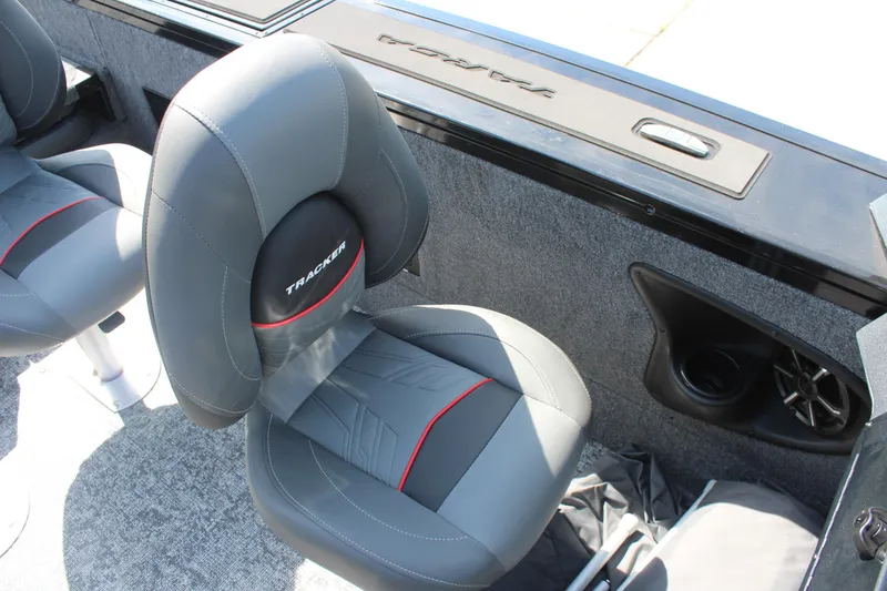 Slide: The Image of 2026 Tracker Targa V-18 Combo boat interior with gray seats and speaker. - 11