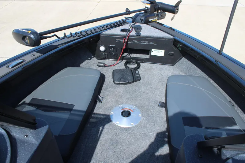 Slide: The Image of 2026 Tracker Targa V-18 Combo boat interior with seating and control panel. - 13