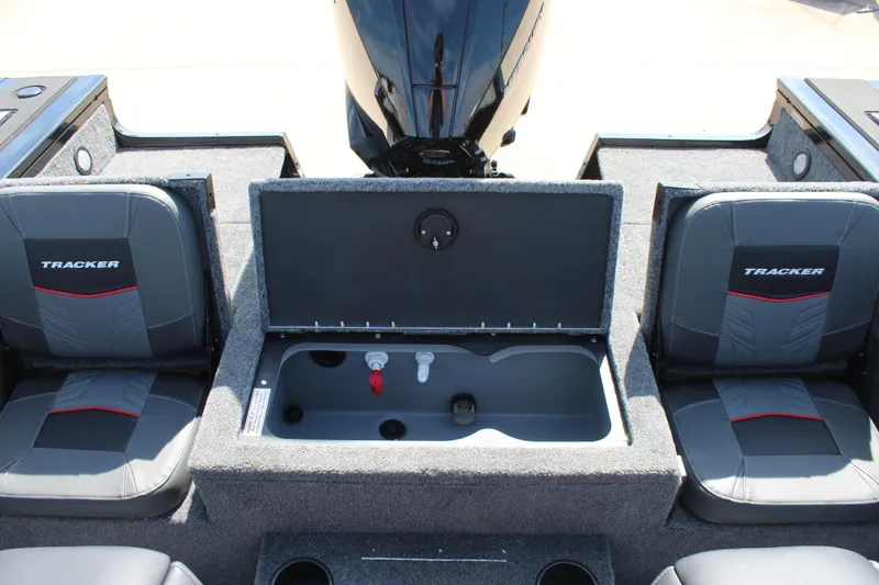 Slide: The Image of 2026 Tracker Targa V-18 Combo boat interior with seating and storage compartment. - 17