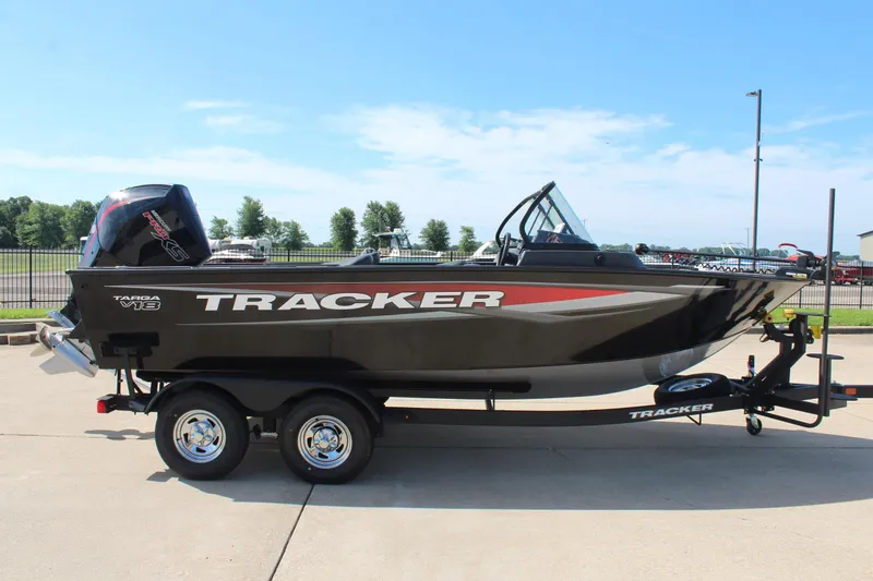 Slide: The Image of 2026 Tracker Targa V-18 Combo boat on trailer, parked outdoors. - 2