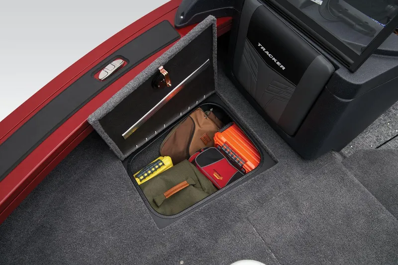 Slide: The Image of Manufacturer Provided Image: Storage compartment in 2026 Tracker Targa V-18 Combo boat with various gear items. - 39