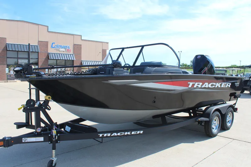 Slide: The Image of 2026 Tracker Targa V-18 Combo boat on trailer outside dealership. - 5