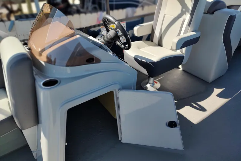 Slide: The Image of Interior of 2026 Sylvan Mirage X3 boat with modern helm and seating. - 14