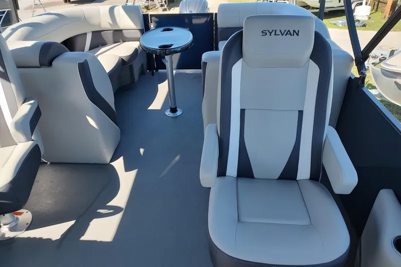 Slide: The Image of 2026 Sylvan Mirage X3 boat interior with plush seating and sleek design. - 19
