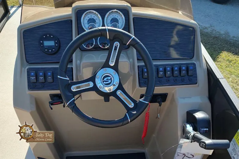 Slide: The Image of 2026 Sylvan Mirage X3 pontoon boat with powerful outboard motor on trailer. - 2