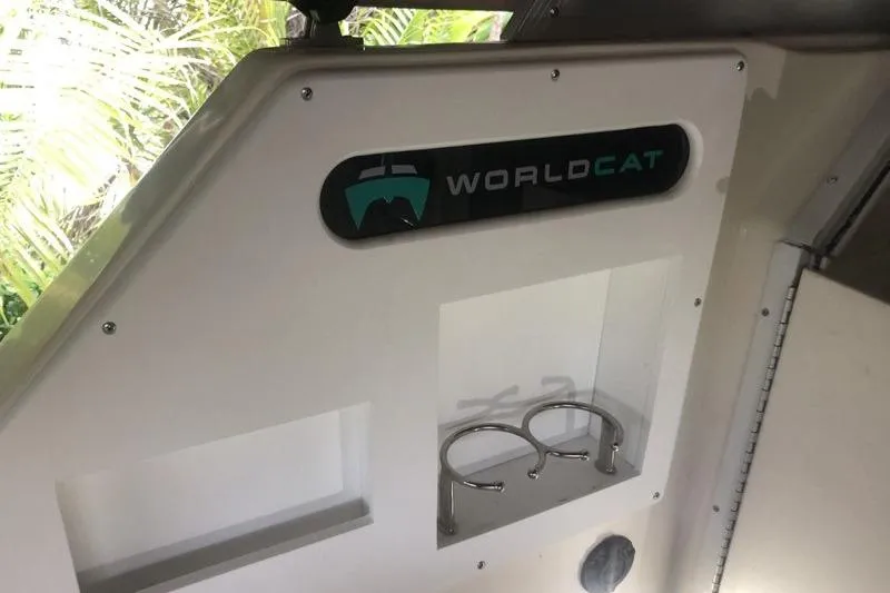 Slide: The Image of Interior of 1998 World Cat 266 SC boat with logo and cup holders. - 12