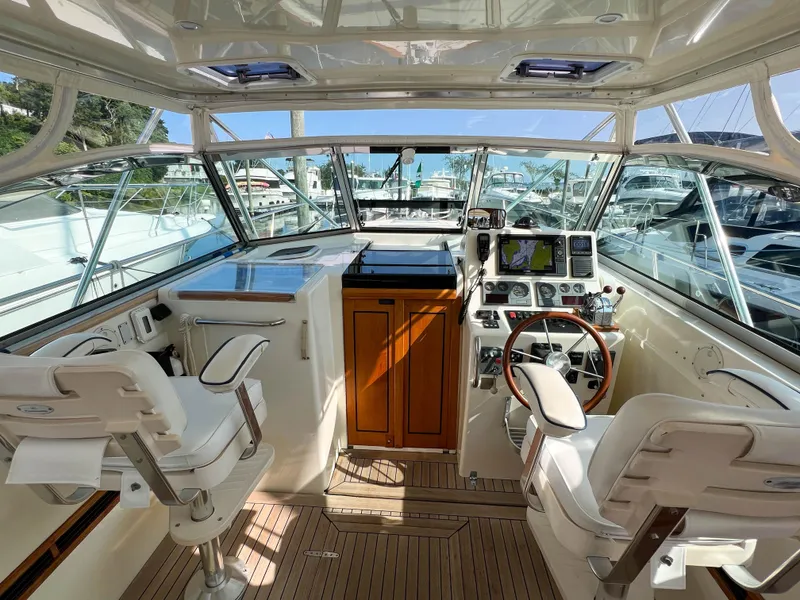 Slide: The Image of Interior of 2001 Sabre 36 Express yacht with helm and seating area. - 19