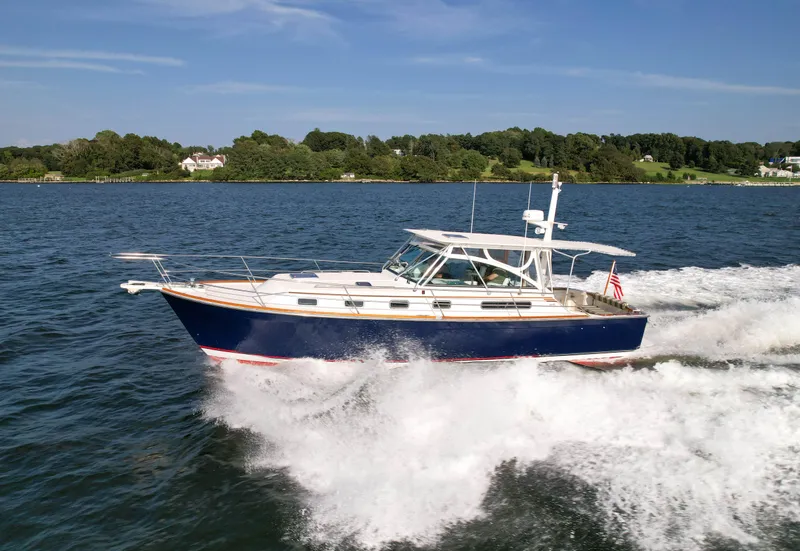 Slide: The Image of 2001 Sabre 36 Express cruising on a scenic lake. - 2