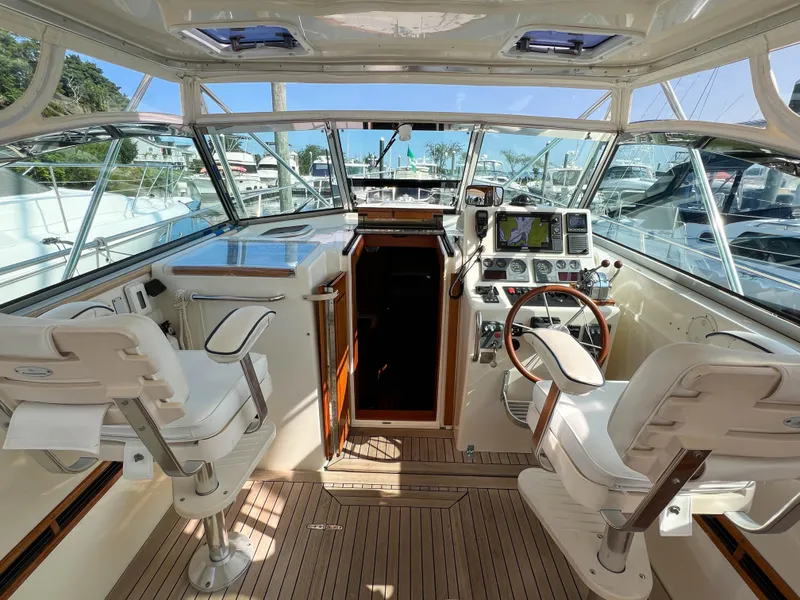 Slide: The Image of Interior of 2001 Sabre 36 Express yacht with helm, seating, and navigation equipment. - 20