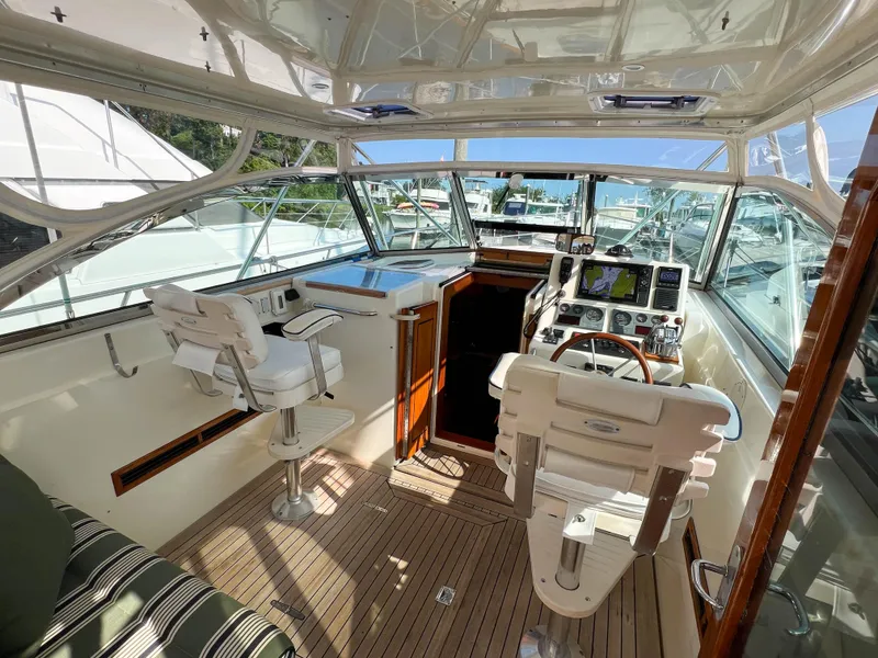 Slide: The Image of Interior of 2001 Sabre 36 Express yacht with helm and seating area. - 21