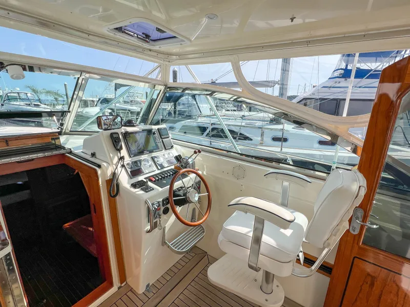Slide: The Image of Interior of 2001 Sabre 36 Express yacht with helm and navigation equipment. - 24