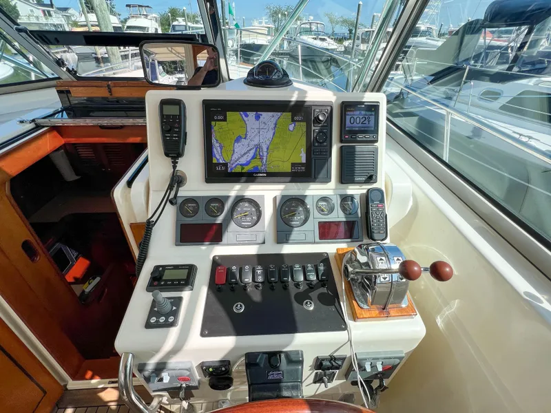 Slide: The Image of 2001 Sabre 36 Express helm with navigation equipment and controls. - 27