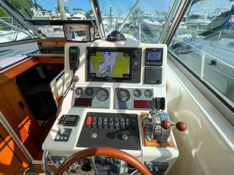Slide: The Image of 2001 Sabre 36 Express helm with navigation controls and gauges. - 28
