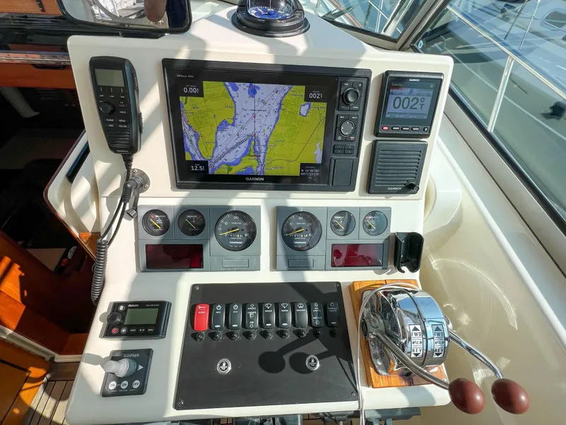 Slide: The Image of Control panel of 2001 Sabre 36 Express boat with navigation and communication equipment. - 29