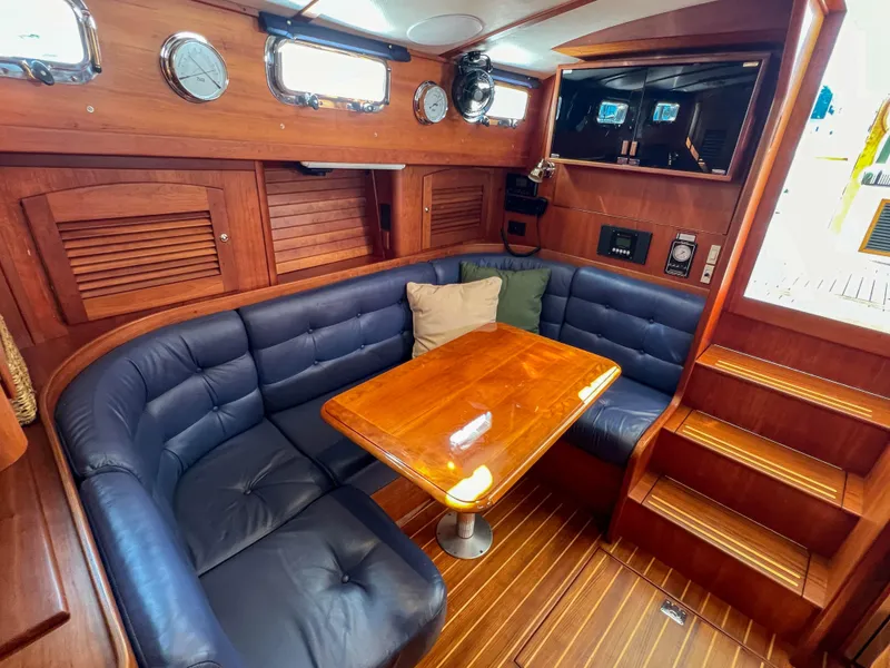 Slide: The Image of Interior of 2001 Sabre 36 Express yacht with wood finish and leather seating. - 32