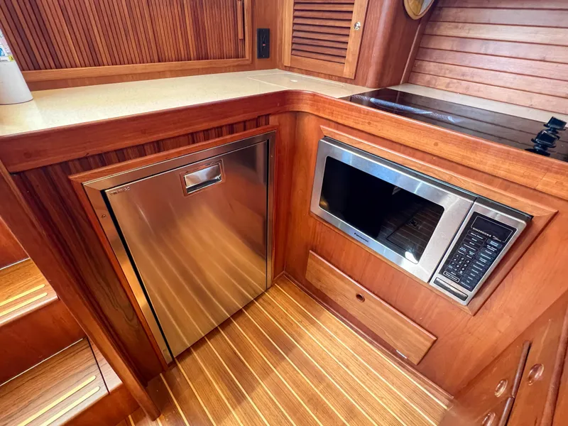 Slide: The Image of 2001 Sabre 36 Express yacht kitchen with microwave and stainless steel appliances. - 37