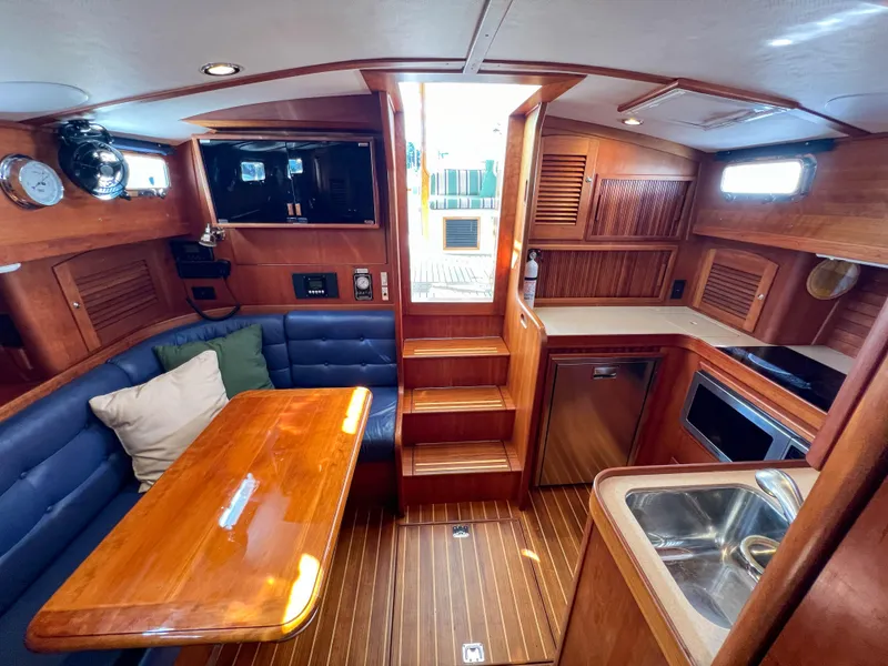 Slide: The Image of Interior of 2001 Sabre 36 Express yacht with wooden furnishings and cozy seating area. - 45