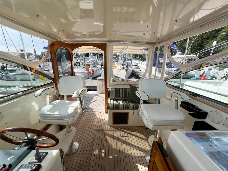Slide: The Image of Interior of 2001 Sabre 36 Express yacht with white seating and wooden accents. - 46