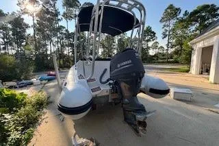 Slide: The Image of 2005 AB Inflatables Nautilus 15 DLX boat with Yamaha outboard motor, parked outdoors. - 5